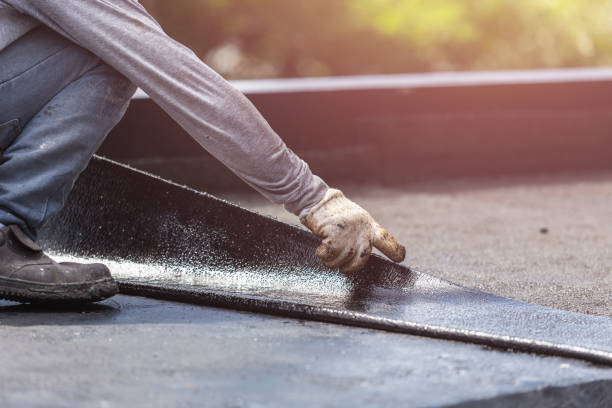 Professional Basement Waterproofing technician working in Glenwood, IN